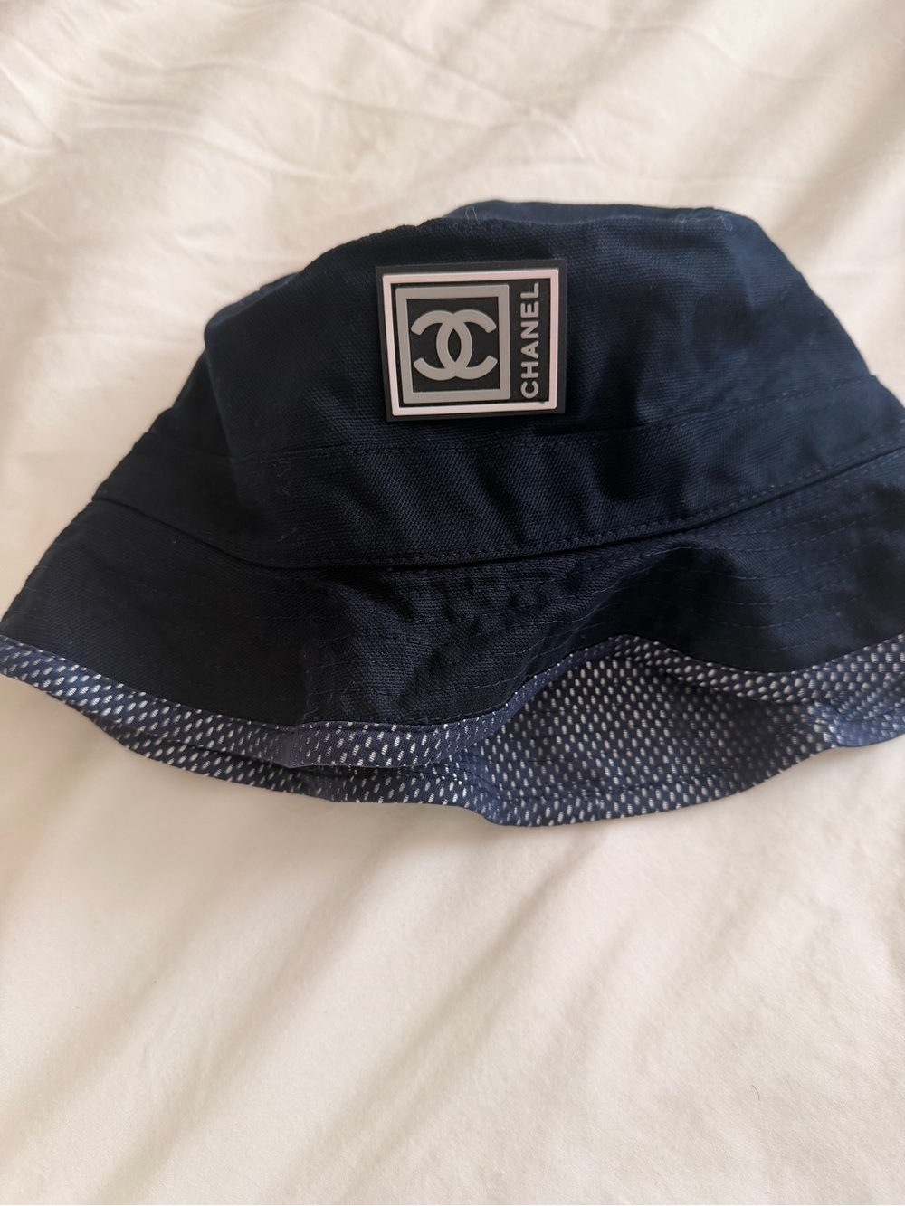 CHANEL Navy Bucket Hat with Contrasting Trim and Logo Patch